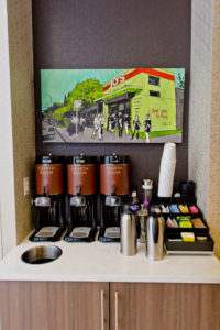 Coffe options lined up in a hotel lobby for guests